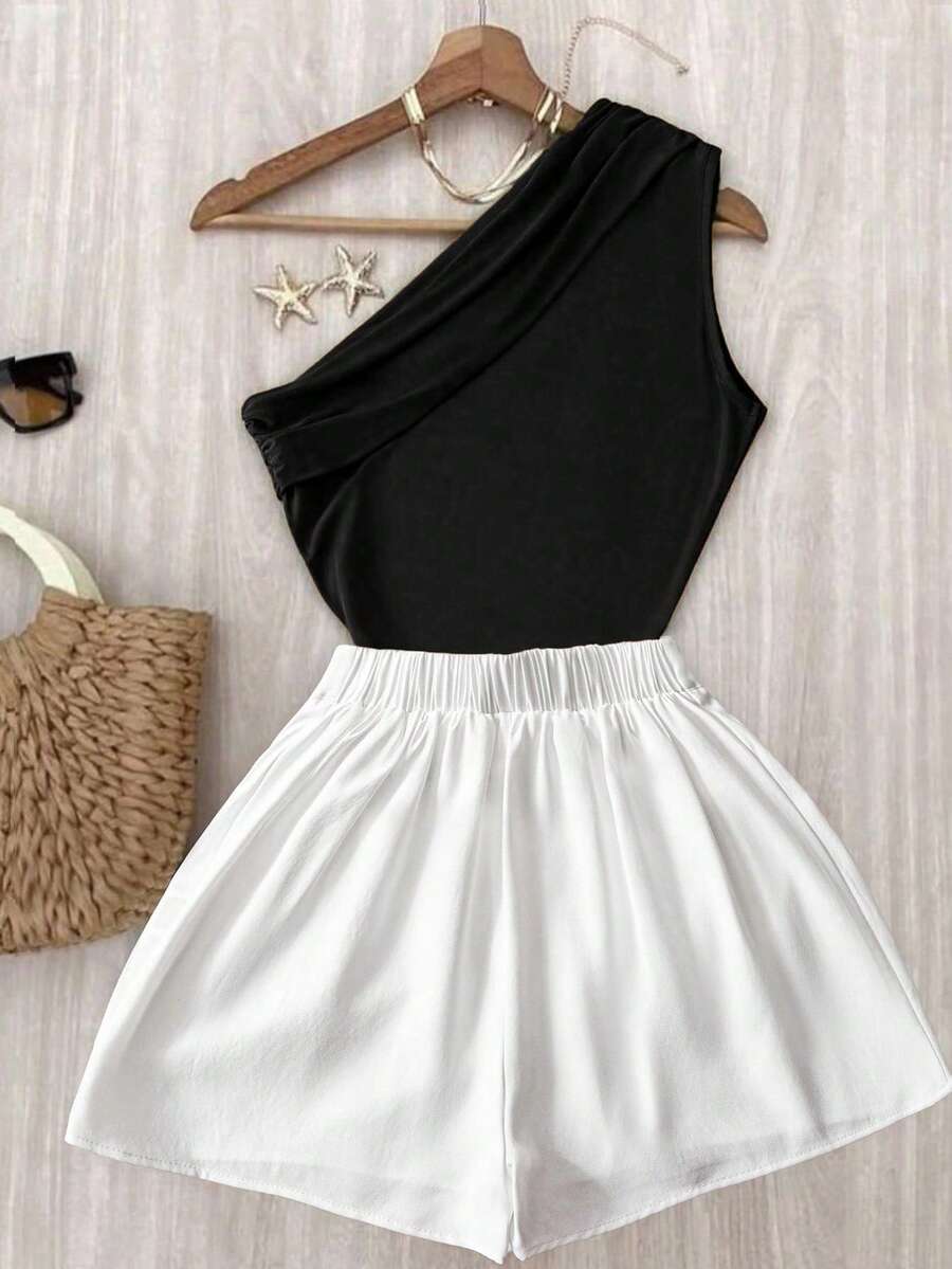 طقم أنيق وعصري مكون من بلوزة كتف وبنطال أبيض بخصر مطاطي